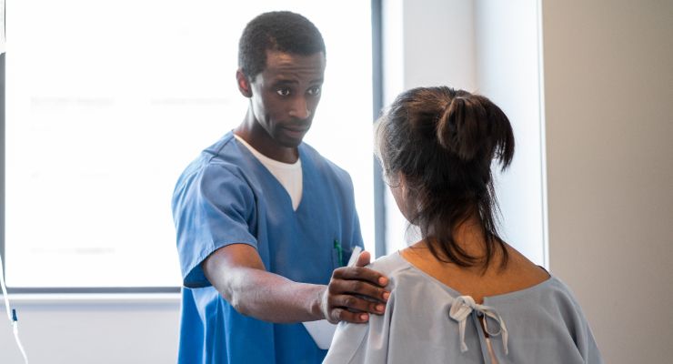 Image of a doctor speaking to a patient