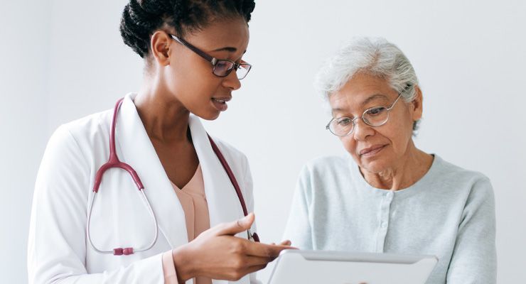 Image of a doctor speaking to a patient