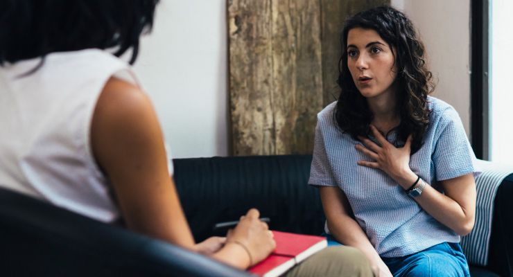 Image of a woman talking to a counselor